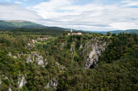 House in the forest above a rock and a gorge near the Skocjanska cave in Slovenia.