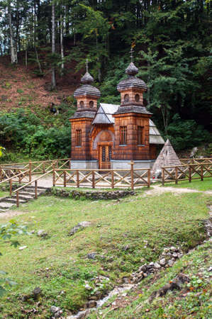 Old wooden russian church in Slovenia in the mountains above the town of Kranjska Gora.の写真素材