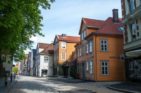 Bergen, Norway - May 21, 2016: Cobblestone street with old wooden houses in the city of Bergen in Norway in northern Europe.のeditorial素材