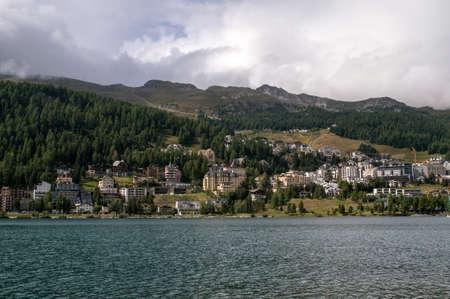 Lake in St. Moritz in Switzerland surrounded by mountainsの写真素材