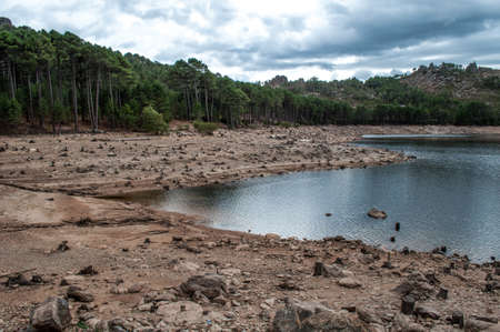 Lake and surrounding landscape with mountains in the background on the island of Corsica