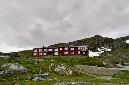 Hotel Krossbu, Norway - July 7, 2011: Red wooden tourist hotel in the mountains in Jotunheimen National Park, Norway.のeditorial素材