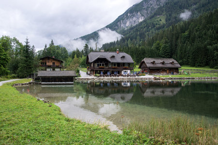 Jagersee, Austria - Wooden hotels and restaurants for tourists on the shore of the lake in the Austrian mountainsのeditorial素材