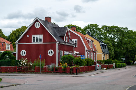 Classic wooden colorful houses in Sweden. A street in a small town in northern Europe.の写真素材
