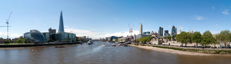 River Thames Embankment skyline in London with skyscrapers, buildings and the Tower.のeditorial素材