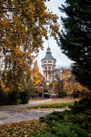 Budapest, Hungary - October 10, 2012: Old water tower in the park in Margaret Island. Autumn with colorful leaves in the park in the city.の写真素材