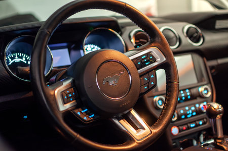 Brno, Czech Republic - September 12, 2023: Interior with steering wheel and cockpit of fast luxury...