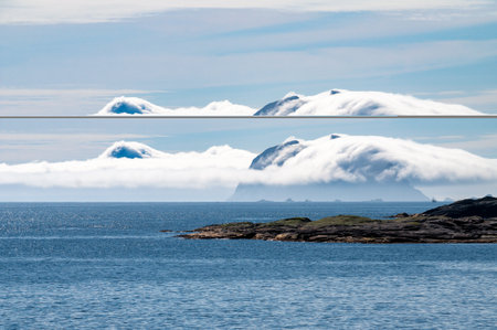A cloud rolling over a cliff in the sea on the coast of the island of Lofoten in Norway.の写真素材