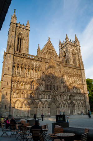 Facade of the cathedral illuminated at sunset in the city of Trondheim, Norway.のeditorial素材