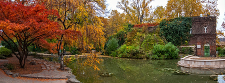 Budapest, Hungary - October 10, 2012: Pakr in Margaret Island in autumn with colorful leaves with a pond.のeditorial素材