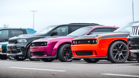 Brno, Czech Republic - December 31, 2023: Several American cars Dodge outside in the parking lot. Meeting of American sports muscle cars.のeditorial素材