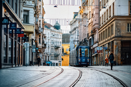 Brno, Czech Republic - March 18, 2024: Street in the old city center with tall buildings with shops....
