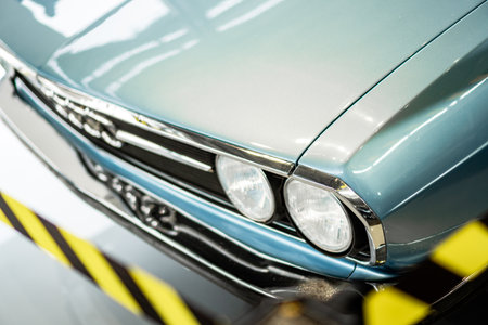 Brno, Czech Republic - March 21, 2024: Detail of the front double light of an old Audi car