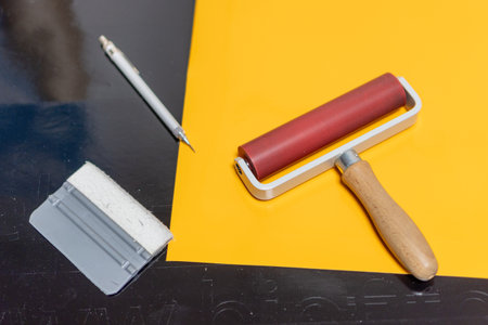 Work tools for the production and installation of advertising stickers from self-adhesive foil.の写真素材