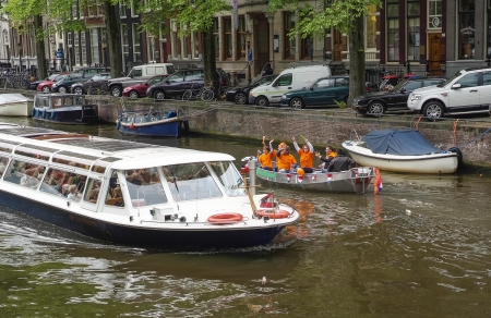 Iconic Scenes from Amsterdam showing Canals, Boats, barges, people, trees, Housesのeditorial素材