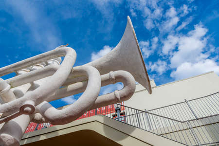 Galveston, Texas, USA December 17 2018. The trumpet or cornet sculpture by David Adickes, located in the Strand Historic District of Galvestonのeditorial素材