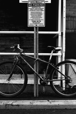 bicycle parked in a tow away zone.の写真素材