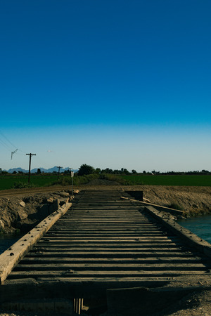 a nice and bright sunny day, in a small desert town walking along side an old abandoned railroad track.の写真素材