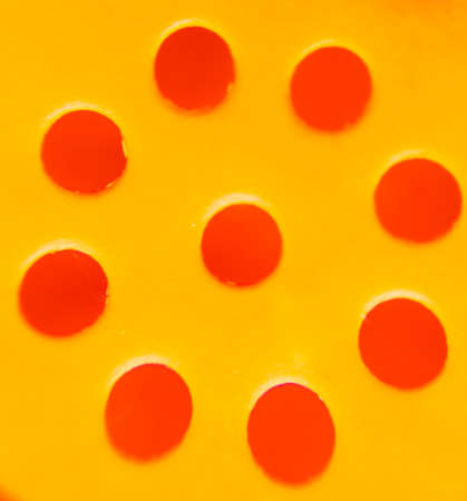 Abstract plastic ground with round holes in redのeditorial素材