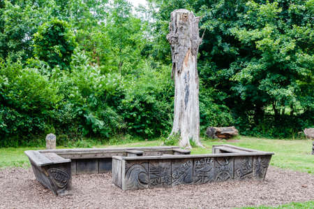 Wood bench made of old tree trunks, merton, Londonのeditorial素材