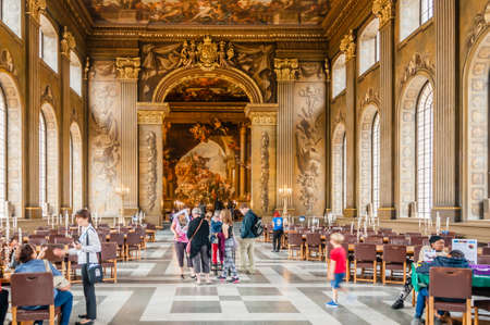 Tourists visiting The Painted Hall a dining hall in the Old Royal Naval College Greenwich Londonのeditorial素材