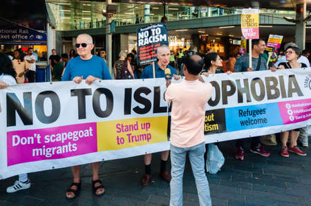 Protesters holding placards & posters at the March Against Racism national demonstration, Stratford, London, UK, in protest of the dramatic rise of acid race related attacks.のeditorial素材