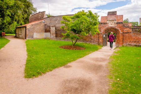 London, United Kingdom, July 19, 2017: Garden Gate Entrance & Wall with Magnolia Treeのeditorial素材