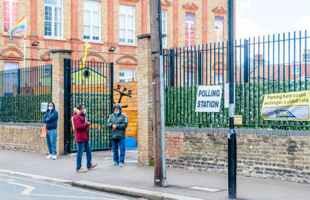 London, United Kingdom, 06 May, 2021: Covid-19, People going to cast their vote at a polling station for the election of the London Mayor and London Assembly Members, Londonのeditorial素材