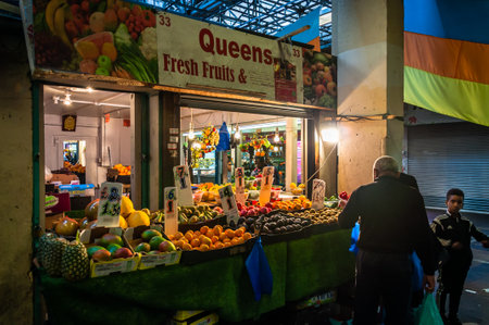 London, United Kingdom, 04 May, 2021: A stall in the covered market, ethnically diverse, selling a  fruit exotic vegetablesのeditorial素材