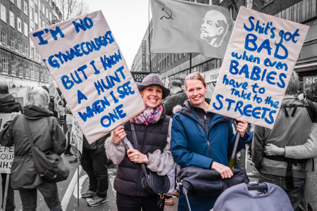 London, England, UK - 4 March 2017: London. Two protesters with their placard demanding that the government leaves the NHS alone.のeditorial素材