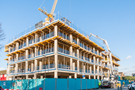 London, United Kingdom, 19 January 2023: A building under construction and a construction crane...