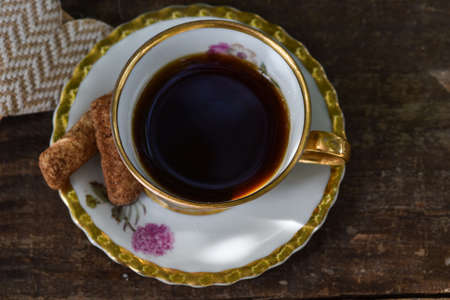 old cup and homemade cookies on rustic backgroundの写真素材