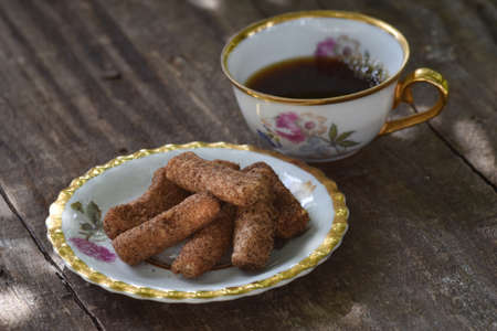 old cup and homemade cookies on rustic backgroundの写真素材