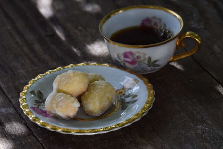 old cup and homemade cookies on rustic backgroundの写真素材