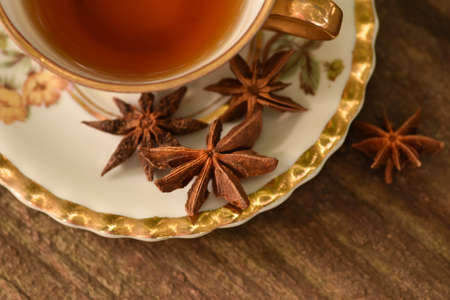 antique cup with star anise teaの写真素材