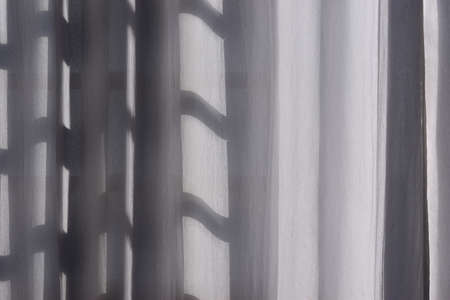 white curtain in front of window in sunny dayの写真素材