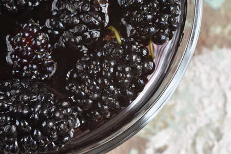 Healthy fruits. Detail of fresh blackberries in the water. Top view.の写真素材