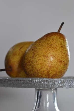 fresh pears. selective focus. a pear cut in half and bitten