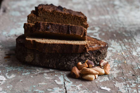 Brown cake with Brazil nuts and cinnamonの写真素材