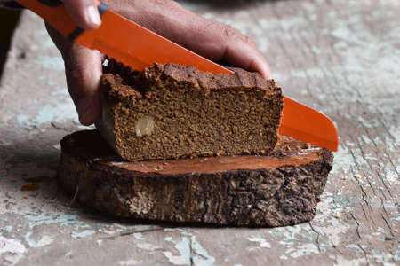 Brown cake with Brazil nuts and cinnamonの写真素材