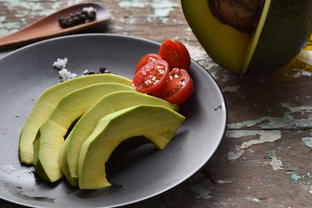 Avocado cut in half. Organic fresh fruit.の写真素材
