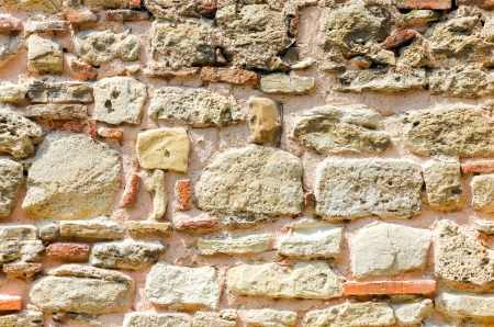 old wall consisting of a sandstone and bricksの写真素材