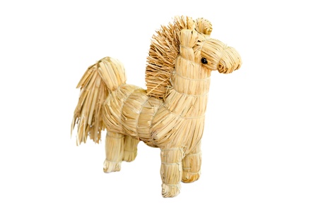 homemade  figurine strawy horse isolated on white backgroundの写真素材