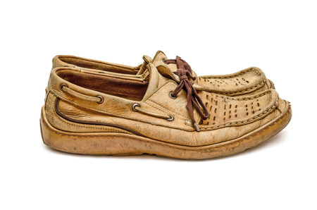 Pair of old leather manâs moccasins side view isolated on white background. Second hand.の写真素材