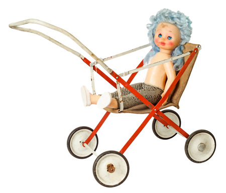 Dirty doll in pram isolated on white backgroundの写真素材