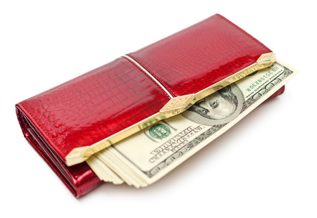 Dollars money in the red purse isolated on white background
