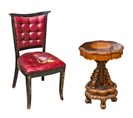 Antique leather chair and round wooden table isolated on white backgroundの写真素材