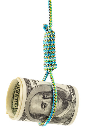 Money debt and credit. Rolled dollars in a noose depicting tough economic times, devaluation, recession and financial collapse.の写真素材