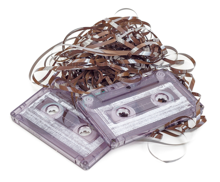 Analog audio cassette with tape tangle isolated on white backgroundの写真素材