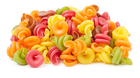 Heap of raw colorful pasta isolated on white background